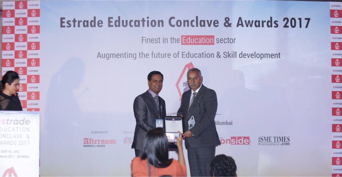 Dr. Nripen Kumar, Founder & Principal - Miles Bronson Residential School receiving Educational Entrepreneur of the Year award from Vishwasjeet Singh, Editor-in-chief - Estrade.in